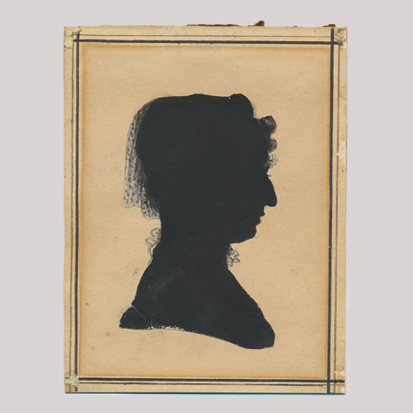 
        Front of silhouette, with woman in square painted frame, looking right.